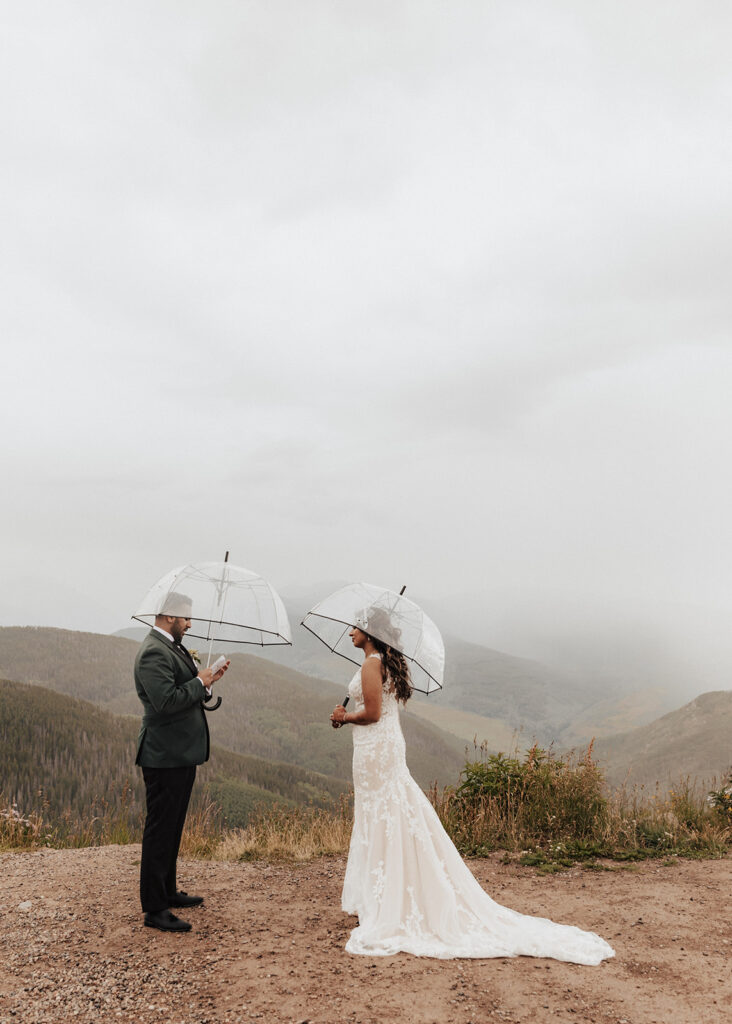 Bride and groom exchanging vows atop Vail Mountain in Colorado.