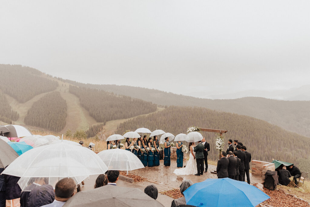 Vail Mountain Wedding Deck wedding ceremony during the rain.