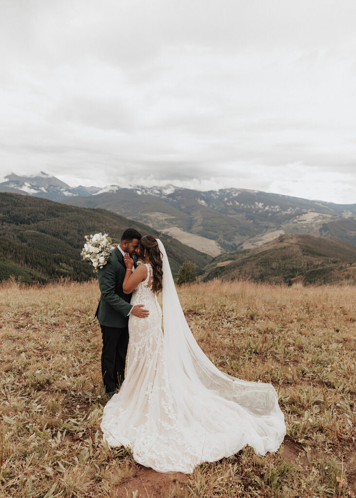 Bride and groom portraits atop Vail Mountain in Colorado.