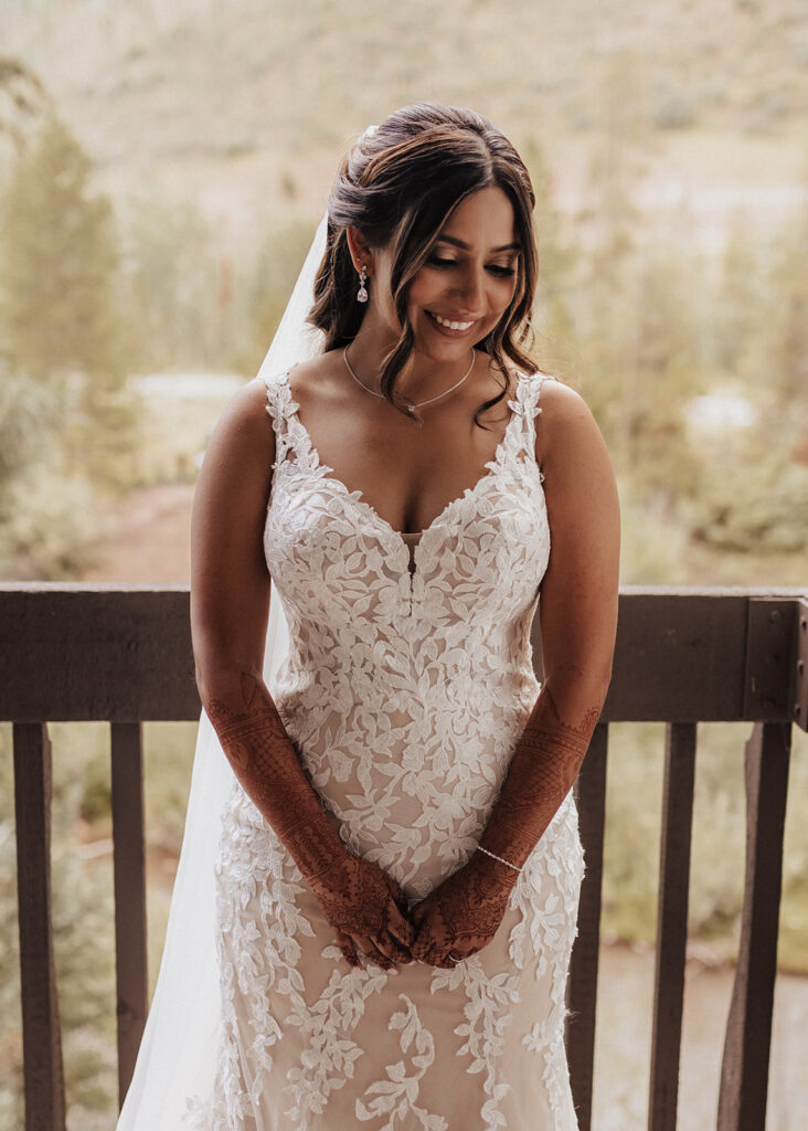Bride dressed in wedding dress in Vail, CO.