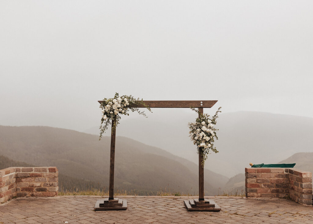 Floral arch at Vail Mountain Wedding Deck in Colorado.