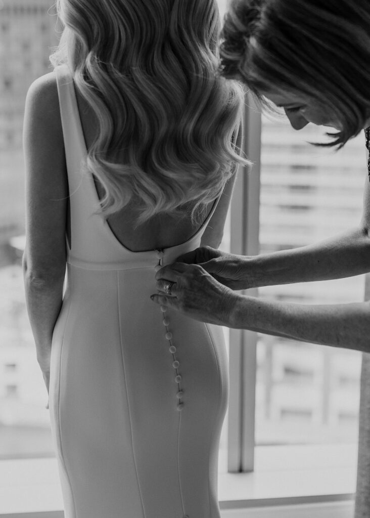 Mom helping bride into dress at The LondonHouse Chicago