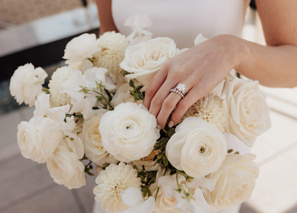 Bride's ring above her bridal bouquet in Chicago, IL