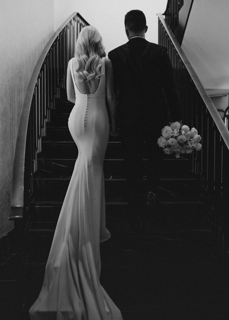 Bride and groom walking up stairs at The LondonHouse Chicago