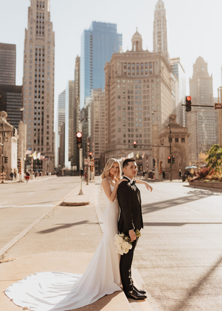 Bride and groom portrait in the middle of Michigan Avenue in Chicago, IL
