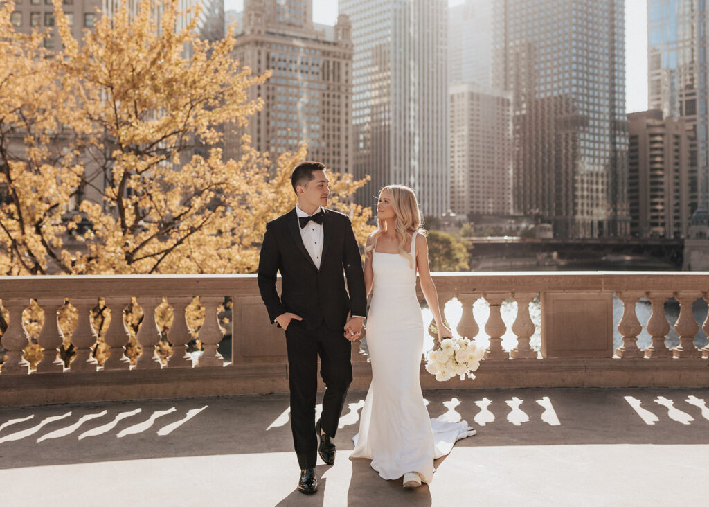 Bride and groom walking along Chicago's Riverwalk