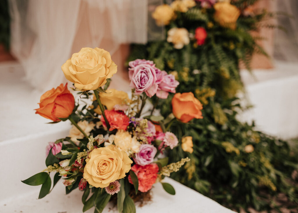 Colorful wedding florals at Ravisloe Country Club