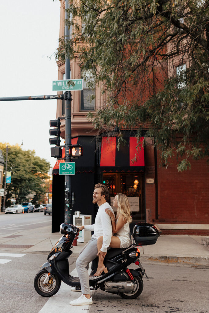 Playful moped engagement photography in Lincoln Park, Chicago