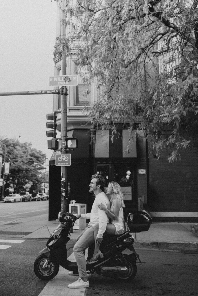 Playful moped engagement photography in Lincoln Park, Chicago