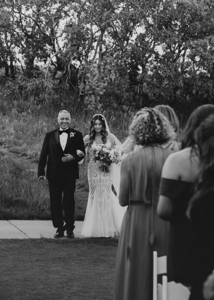 Father walking daughter down the aisle at Arrowhead Golf Course wedding