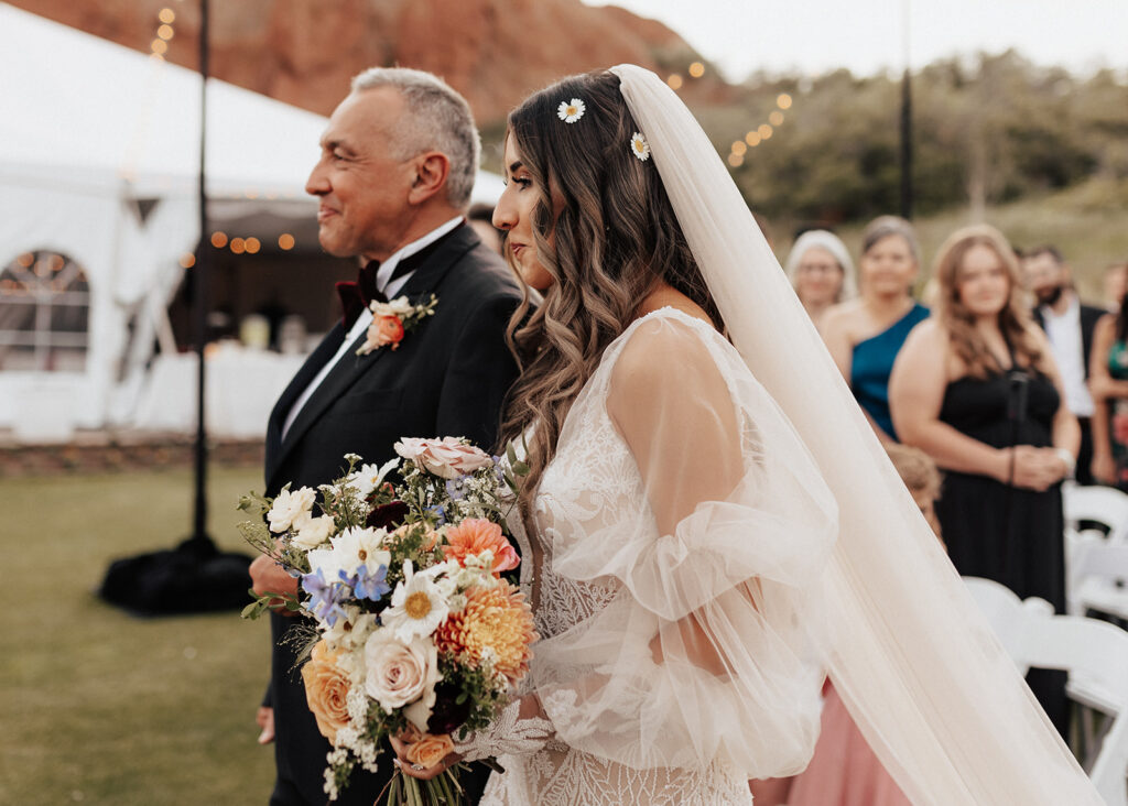 Father walking daughter down the aisle at Arrowhead Golf Course wedding