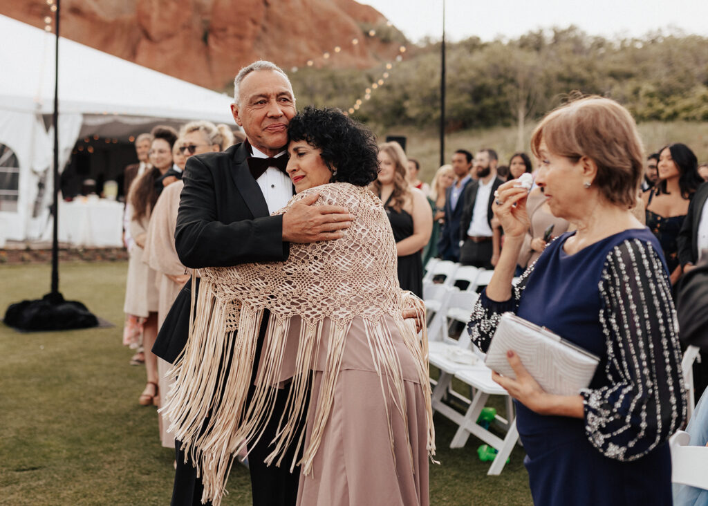 Father hugging mother at Arrowhead Golf Course wedding