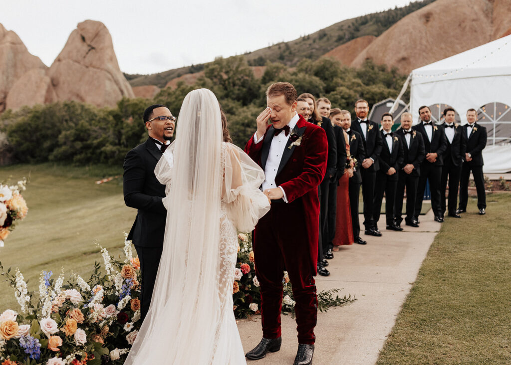 Groom crying during wedding ceremony at Arrowhead Golf Course