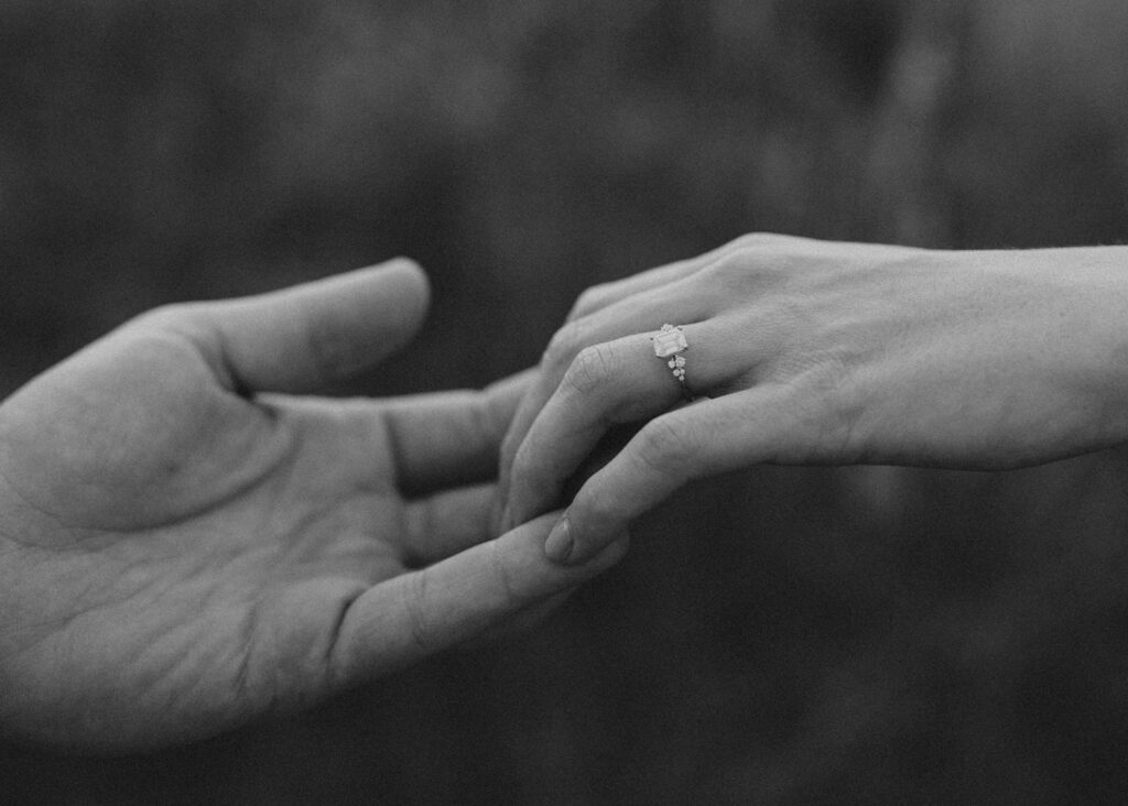 Close-up of engaged couple's hands