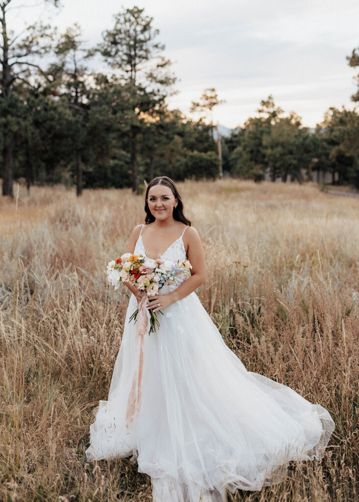 Bridal portrait in a field at The Lofthouse in Colorado Springs, CO