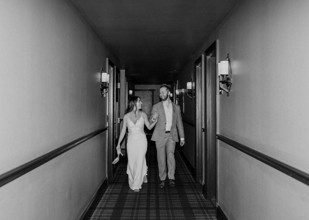 Bride and Groom up the hallway of The Ramble Hotel in Denver, CO