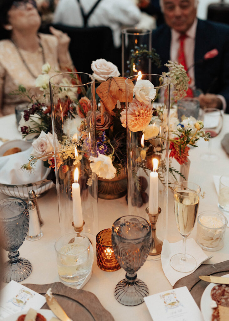 Candle-lit centerpieces during wedding reception at Blackstone Rivers Ranch.