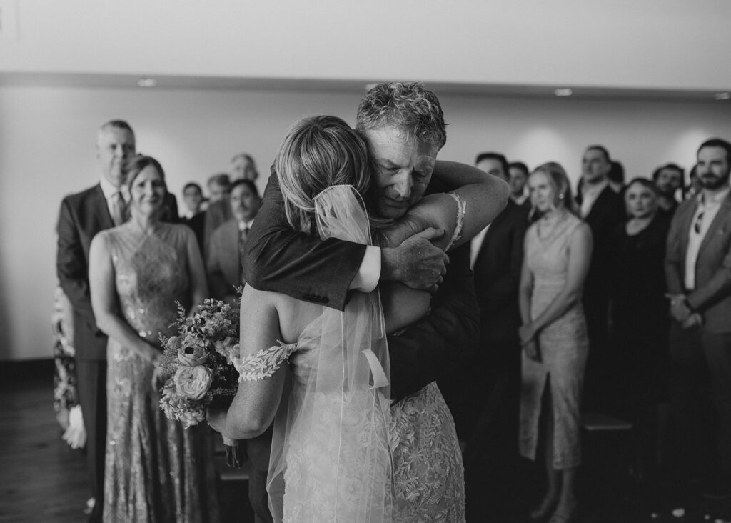 Bride and her Dad hugging during wedding at Black Canyon Inn