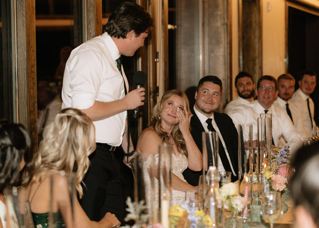 Bride crying during speech from her brother at her wedding