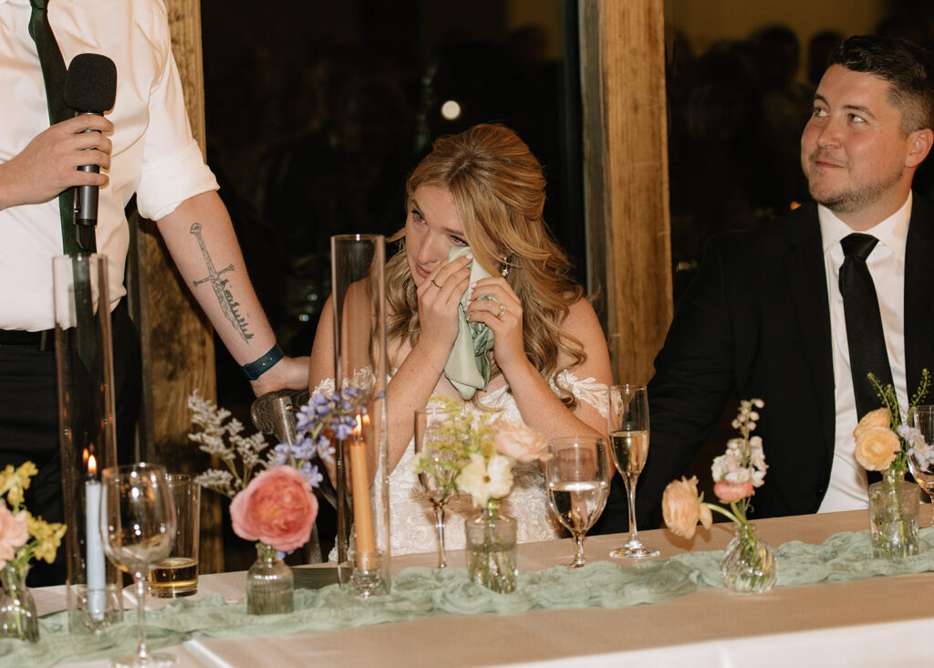 Bride crying during speech from her brother at her wedding