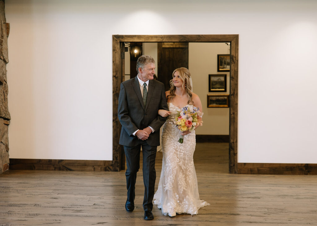 Bride and her Dad walking down the aisle at Black Canyon Inn