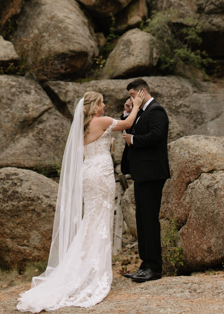 Bride and groom reading vows at Black Canyon Inn in Estes Park, CO